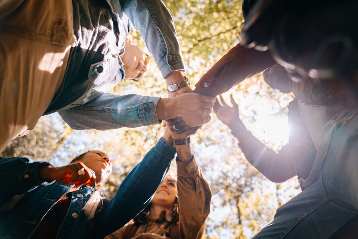 People putting their hands together